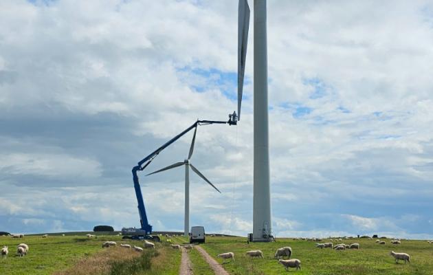 technicians working on turbine blades